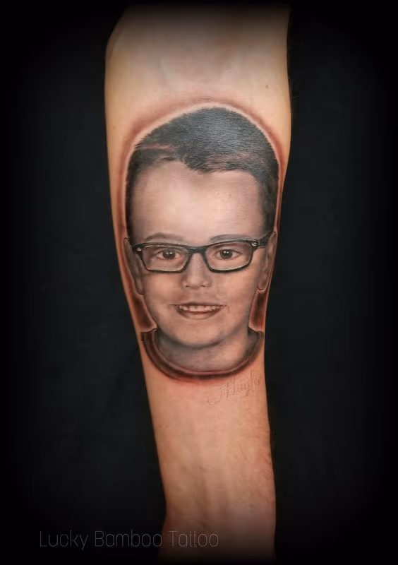 Child portrait tattoo by Haylo