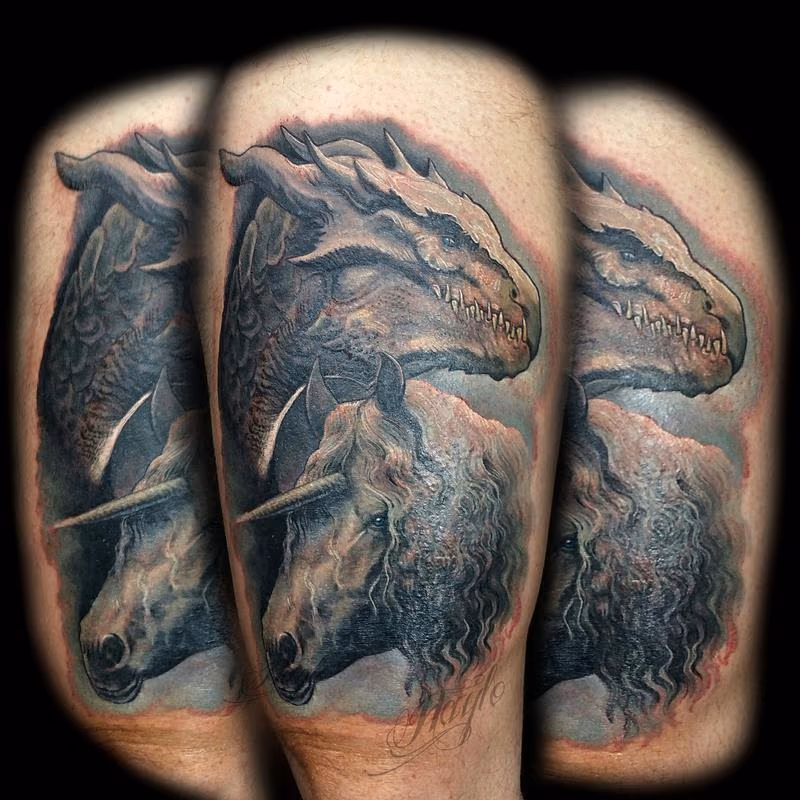 Realistic, full color dragon with unicorn thigh piece