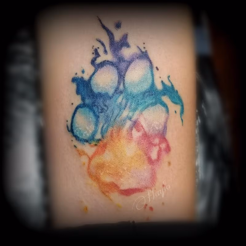 Paw print watercolor tattoo by Haylo