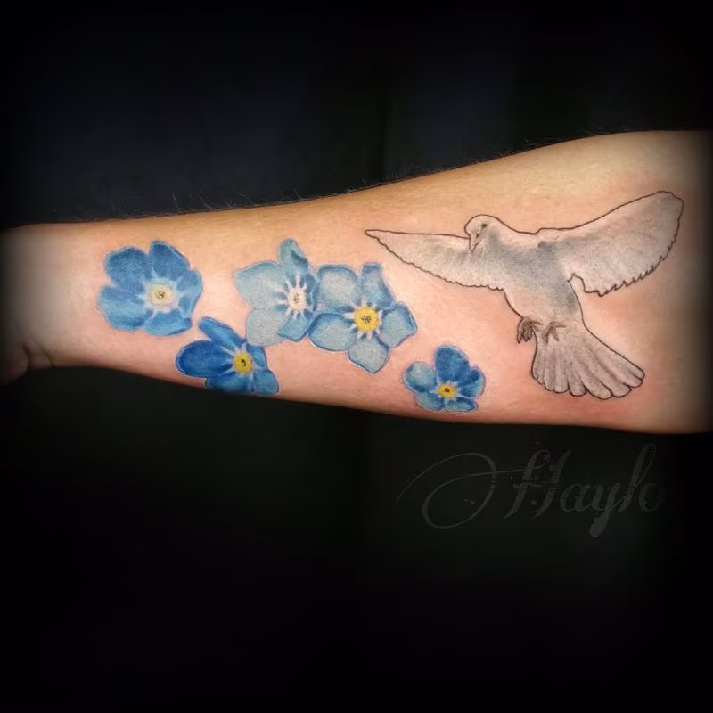 Realistic Dove with forget me not flowers