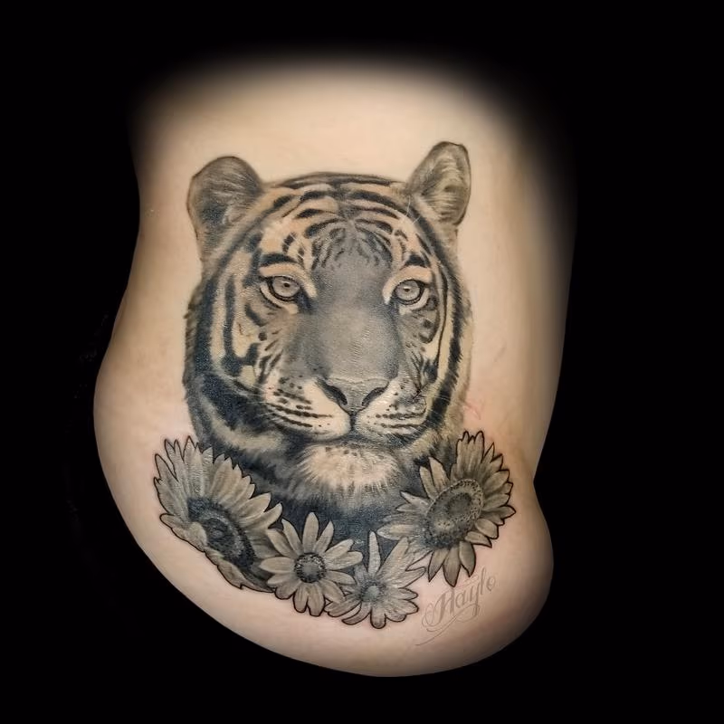 Realistic black and gray tiger with sunflowers