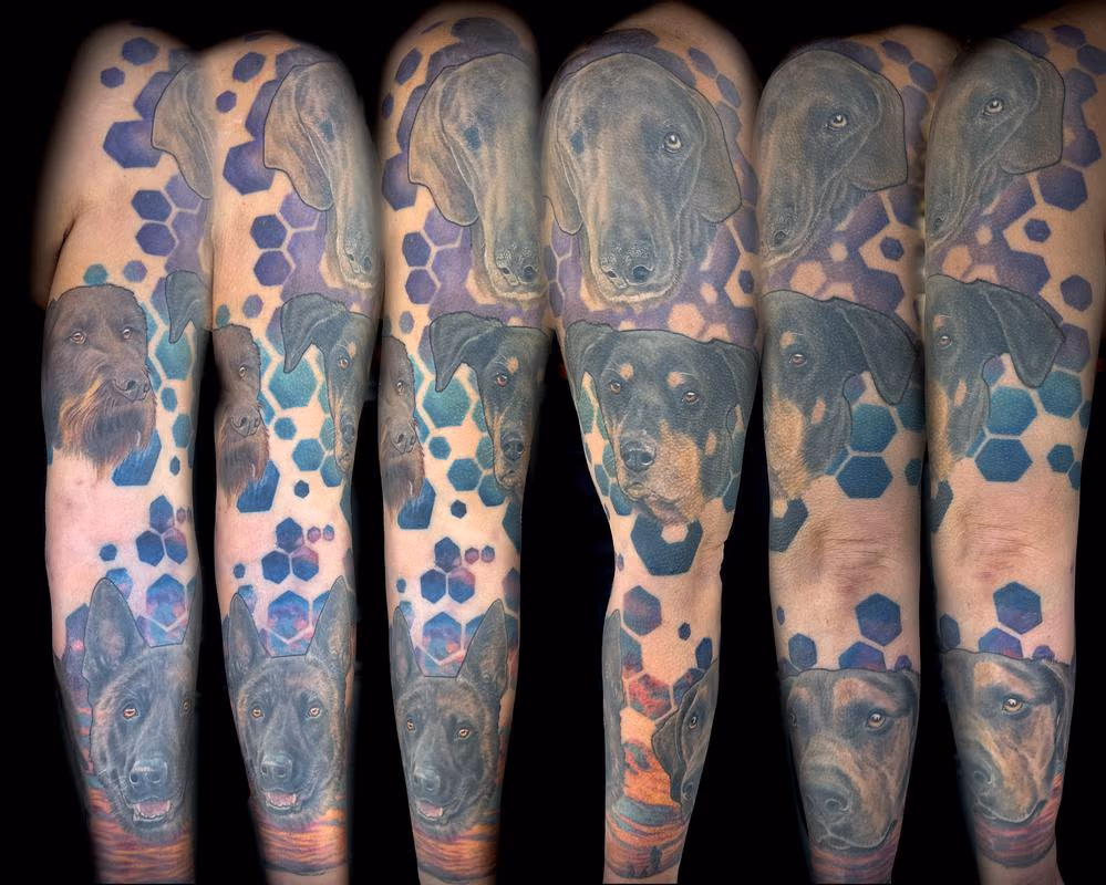 Colored tattoo sleeve of dogs by Haylo