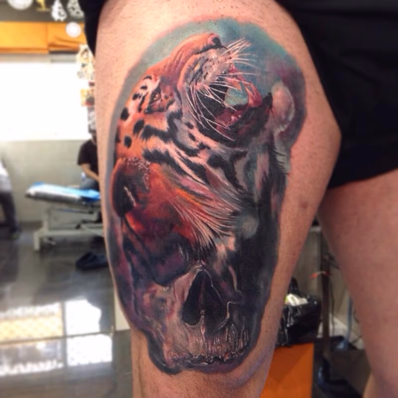 Skull and tiger realistic tattoo in colour