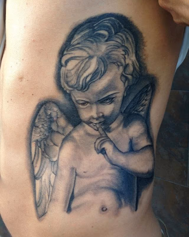 Realist tattoo of the sculpture of Falconet in black an grey on ribs
