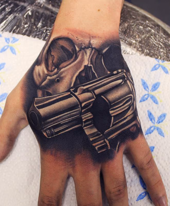 Skull and Gun Hand tattoo