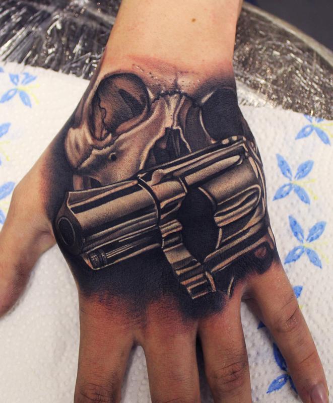 Skull and Gun Hand tattoo