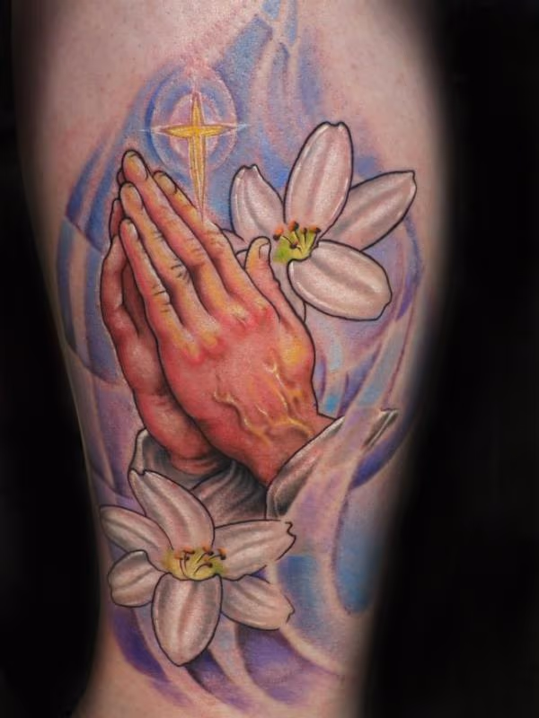 Praying hands with Easter lilies