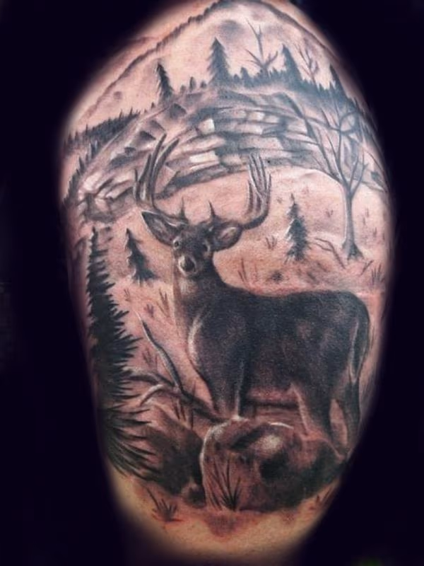 Quarter sleeve hunting tattoo
