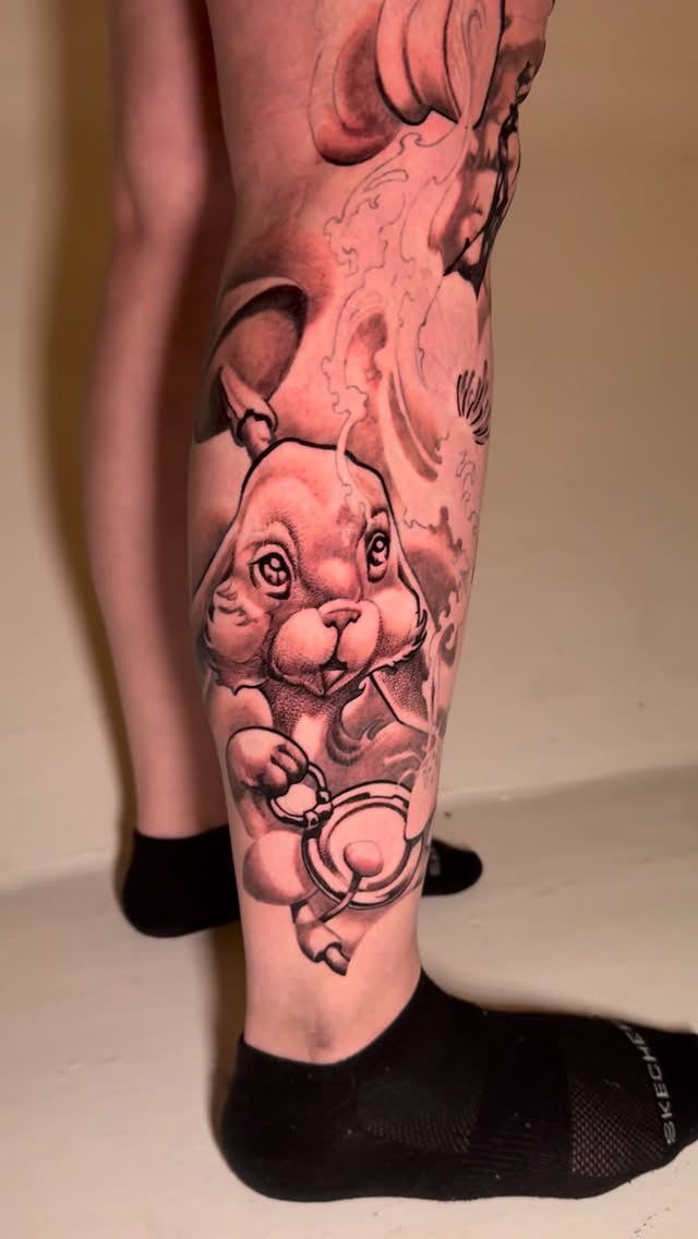 Black-and-grey Alice in Wonderland rabbit, calf