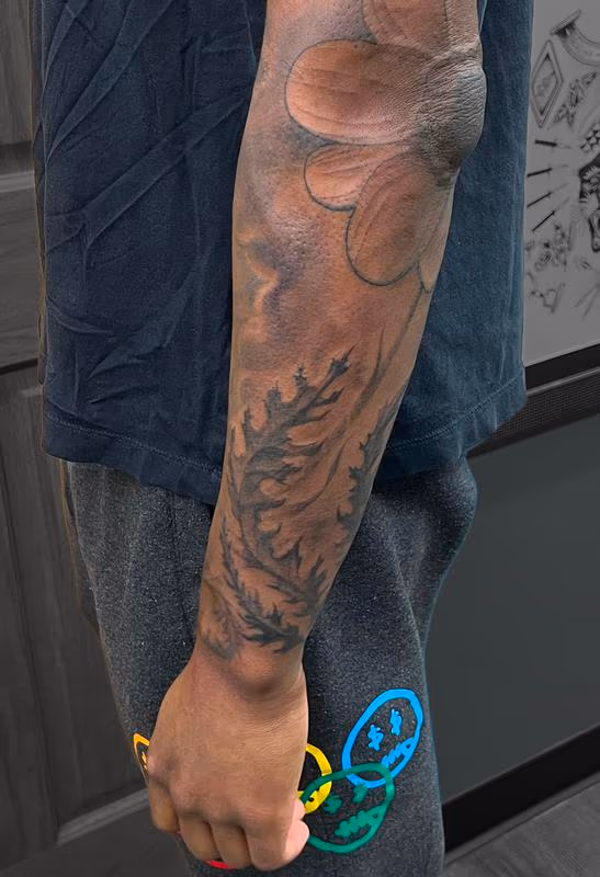 Daisy flower with bio leaves tattoo