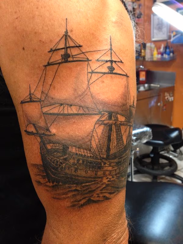 Black and Gray Ship Tattoo