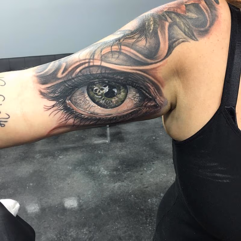 Black and Gray Piercing Gaze Tattoo