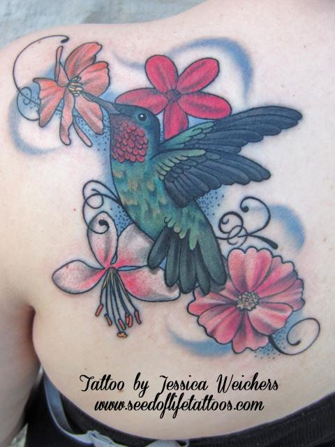 Feminine hummingbird and floral piece