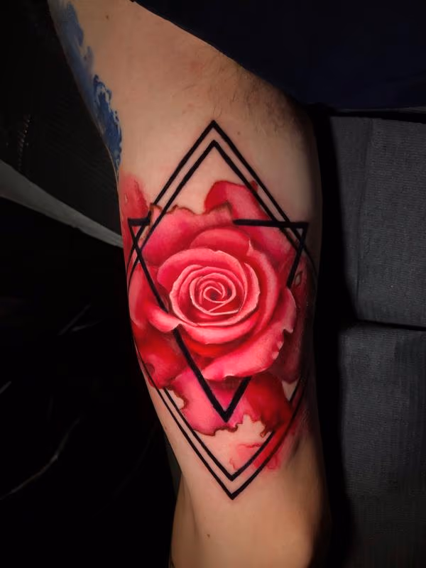 Watercolor rose tattoo done by John Graefe
