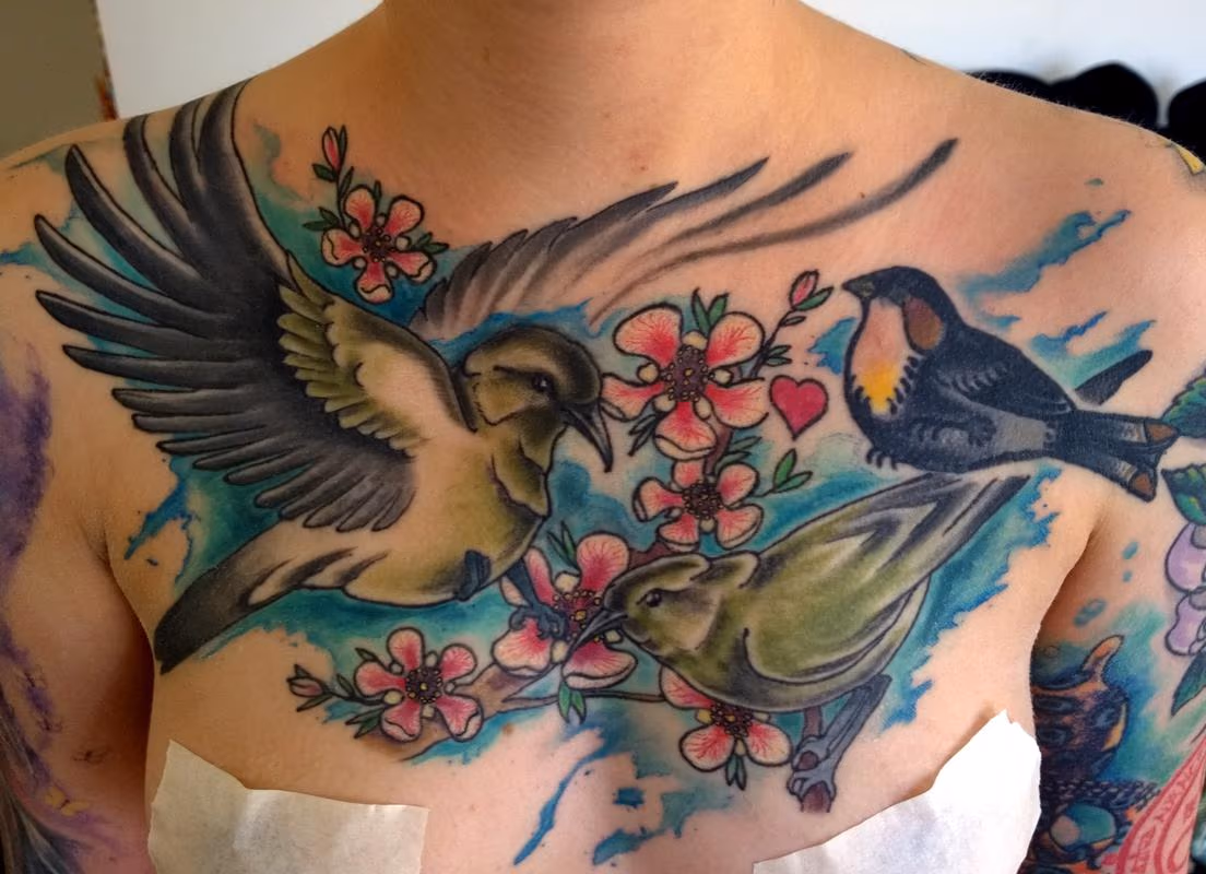 Lovely Feminine Watercolor Chest Tattoo