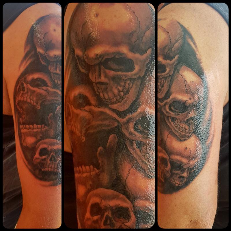 Black and Gray Skull Half-Sleeve Tattoo