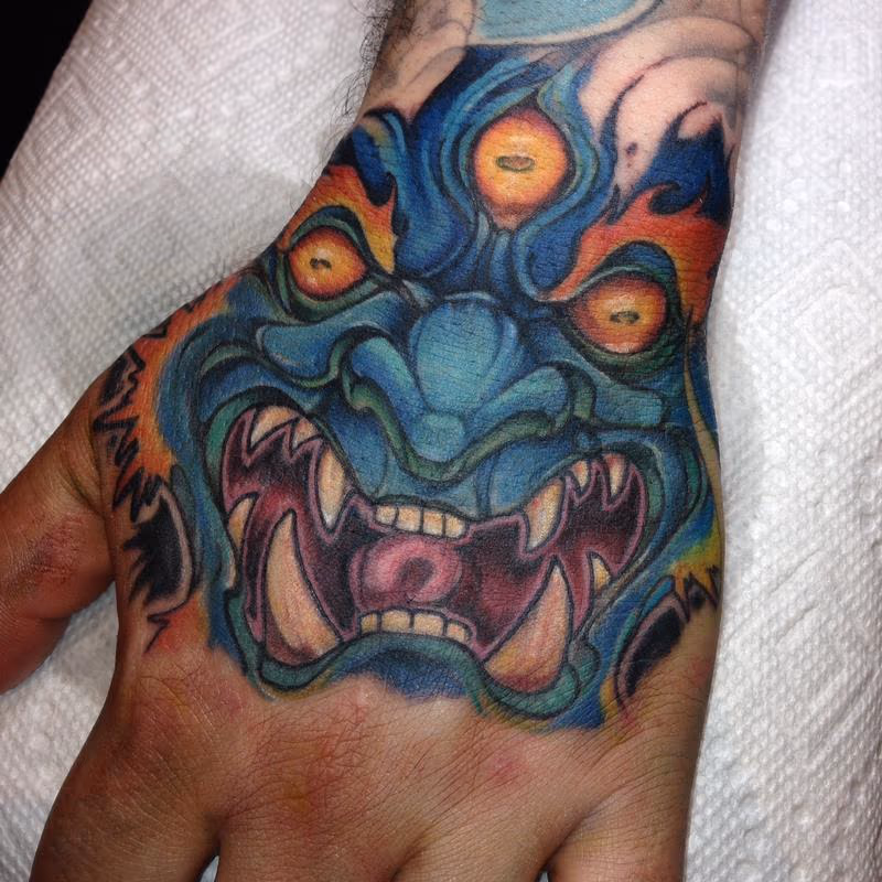 Mara tattoo done forehand on a hand at the Detroit show 2015 by Kelly  Gormley