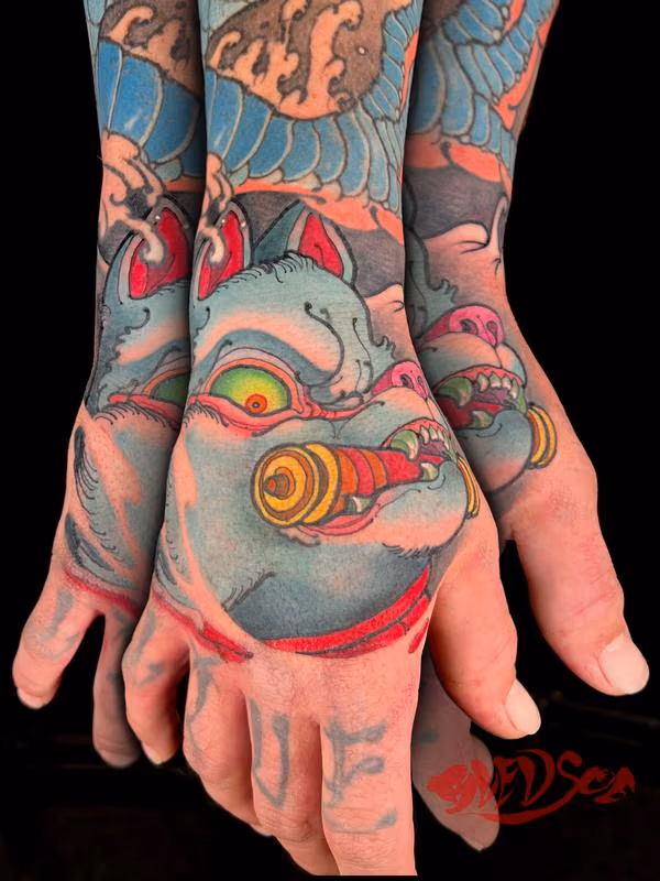 Inari Japanese fox hand tattoo