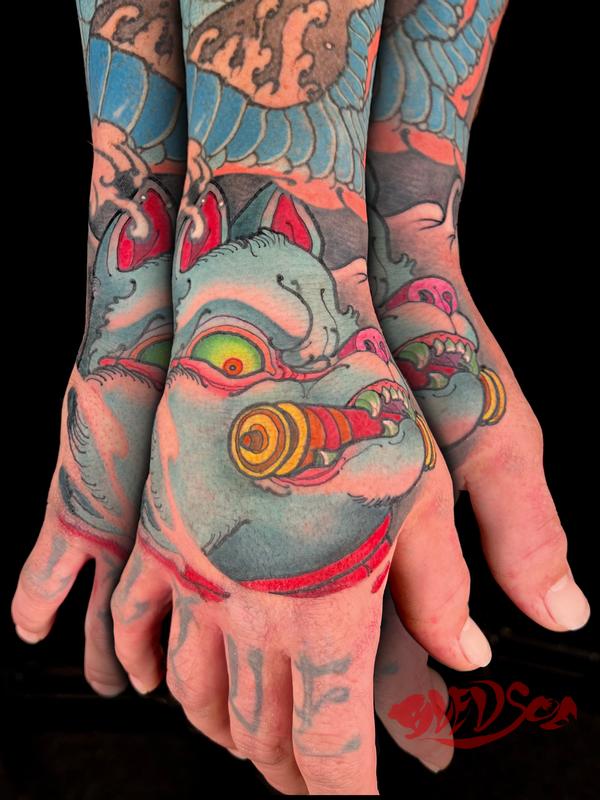 Inari Japanese fox hand tattoo