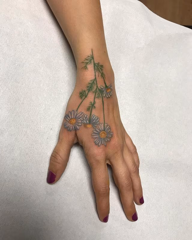 Flowers in Color Tattoo on the Hand