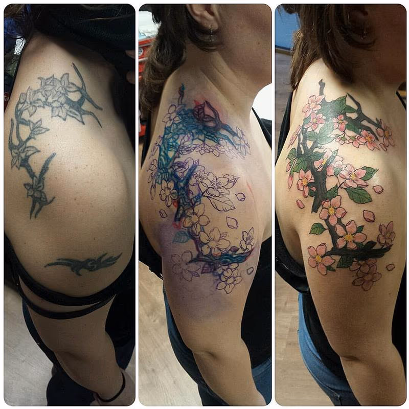 Cover-Up Tattoo of a Tribal with Cherry Flowers