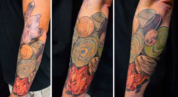 A variety of crystals arm tattoo