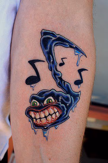 Angry music note tattoo