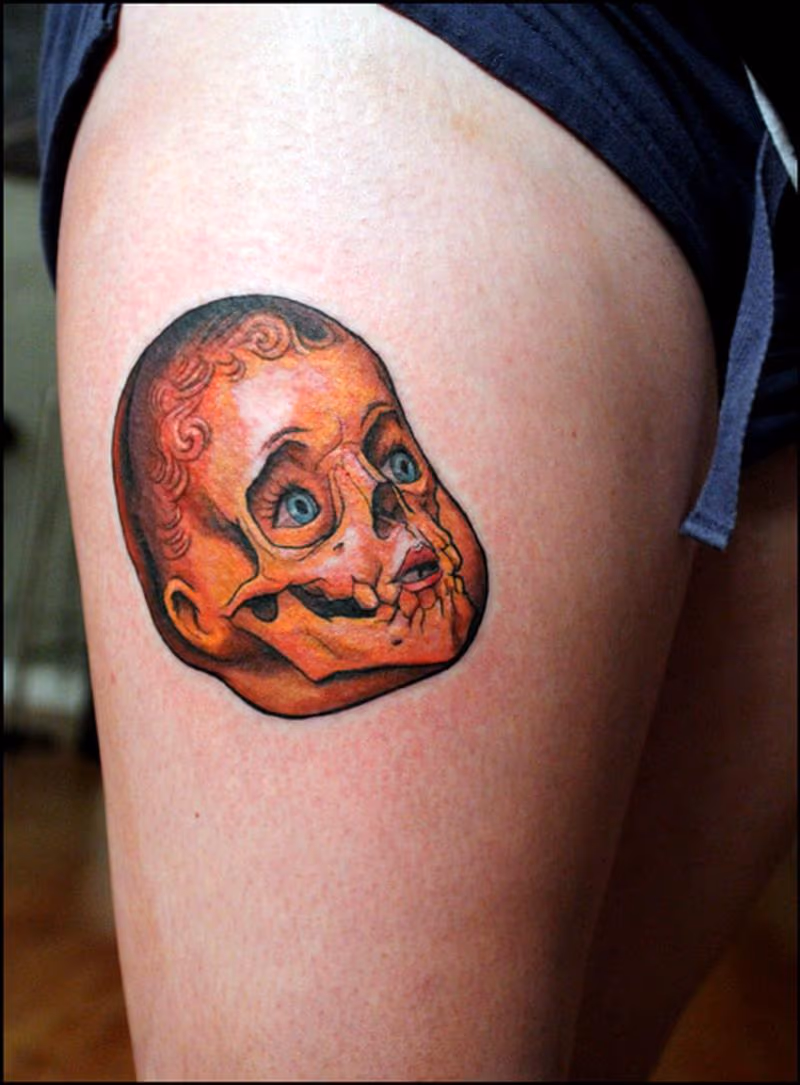 doll skull tattoo