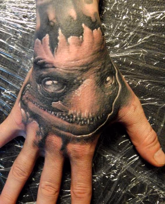 creepy hand tattoo