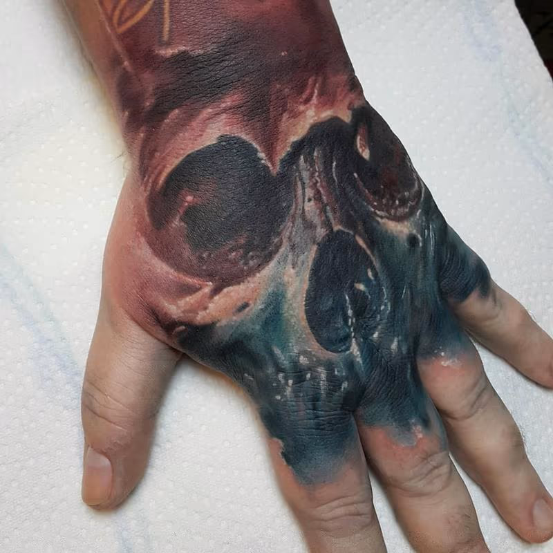 Skull hand tattoo