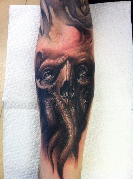 evil forearm skull tattoo