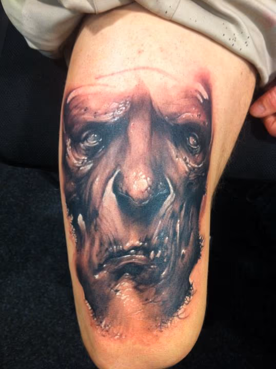 Creepy face tattoo