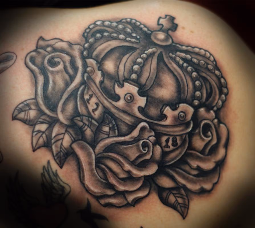 Black and grey crown tattoo