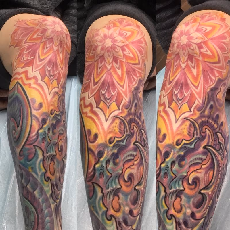 Bio mech mandala knee tattoo