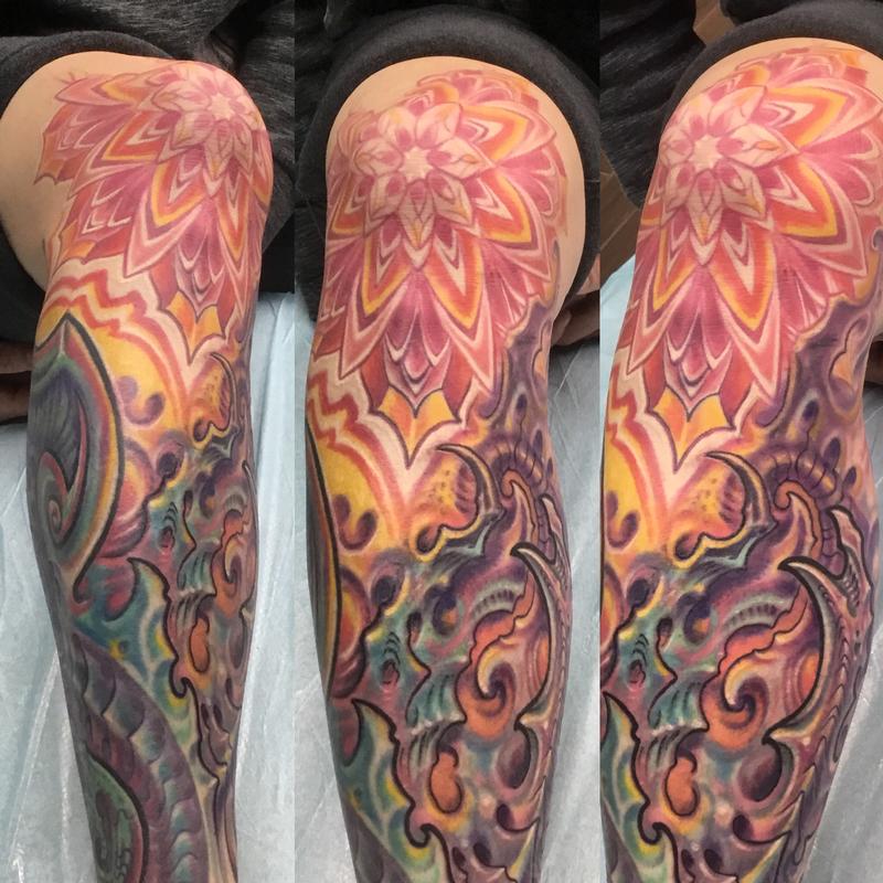 Bio mech mandala knee tattoo