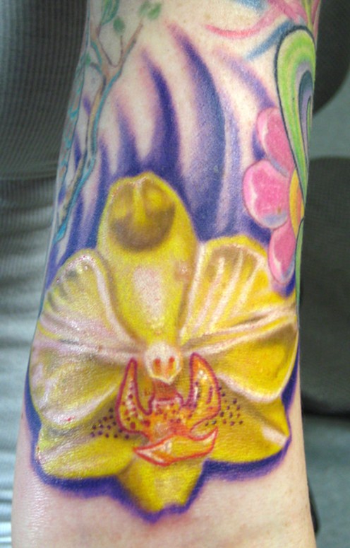 Here is a little add on to Katie's half sleeve. We are gonna add a shiny black cricket above the elbow next and then I'll post healed pics of her whole tattoo. color, orchid tattoo,