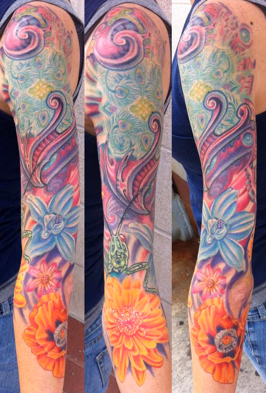 Flower and bio mech sleeve tattoo