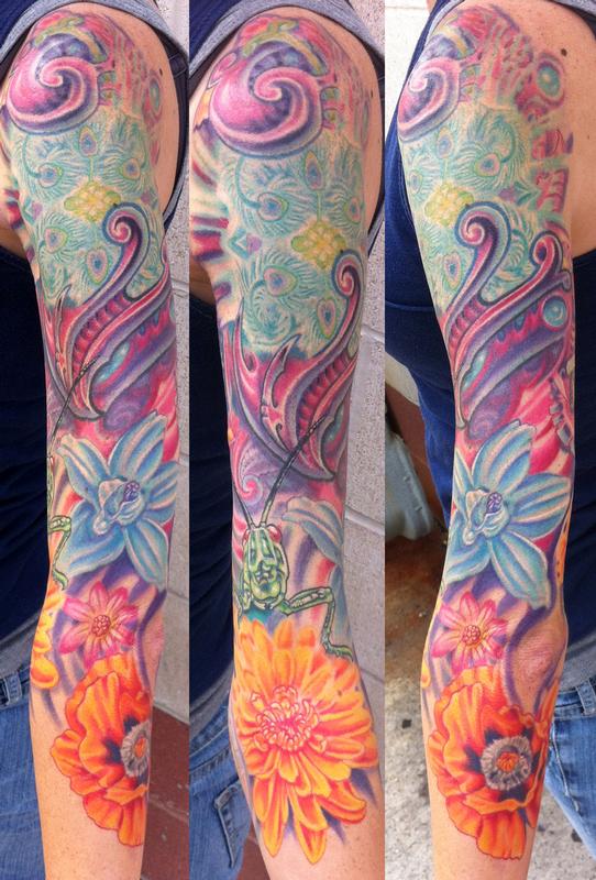 Flower and bio mech sleeve tattoo