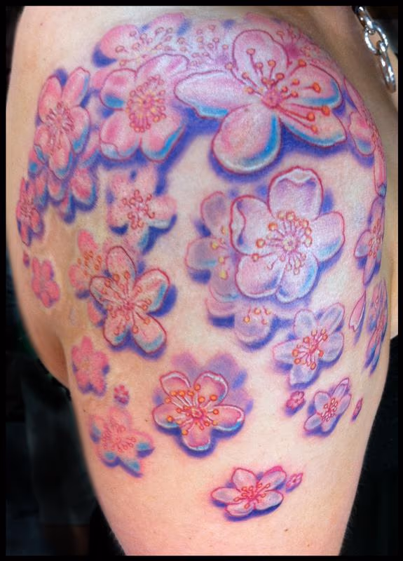 Cluster of cherry blossoms tattoo