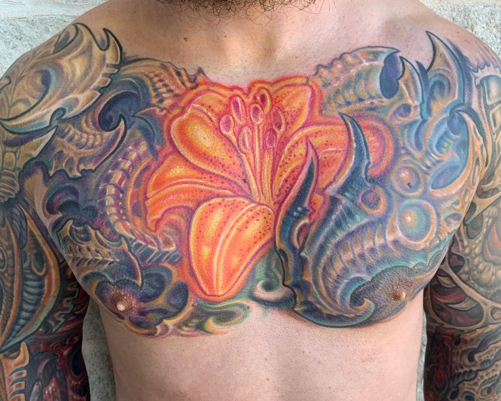 Biomech and glowing lily tattoo