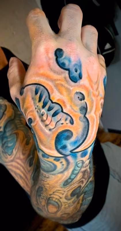Biomech hand tattoo