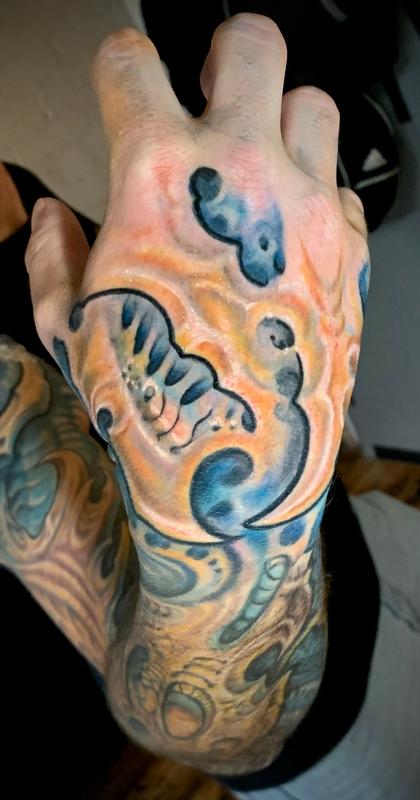Biomech hand tattoo