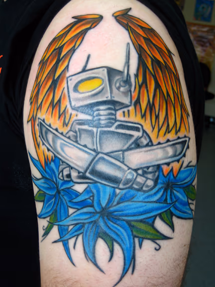 This robot is on a rad kid named Lou. We started this thing like 4 years ago and I just got to finish up. We will be adding onto this arm in the near future. color robot tattoo