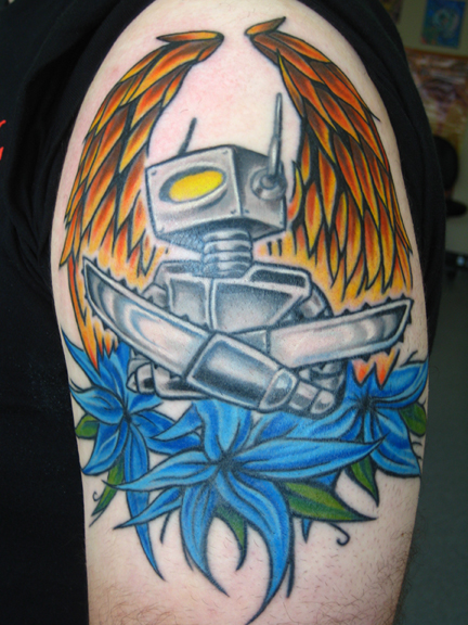 This robot is on a rad kid named Lou. We started this thing like 4 years ago and I just got to finish up. We will be adding onto this arm in the near future. color robot tattoo