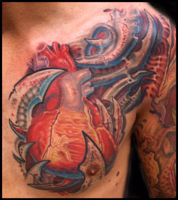 anatomical heart and bio mech tattoo