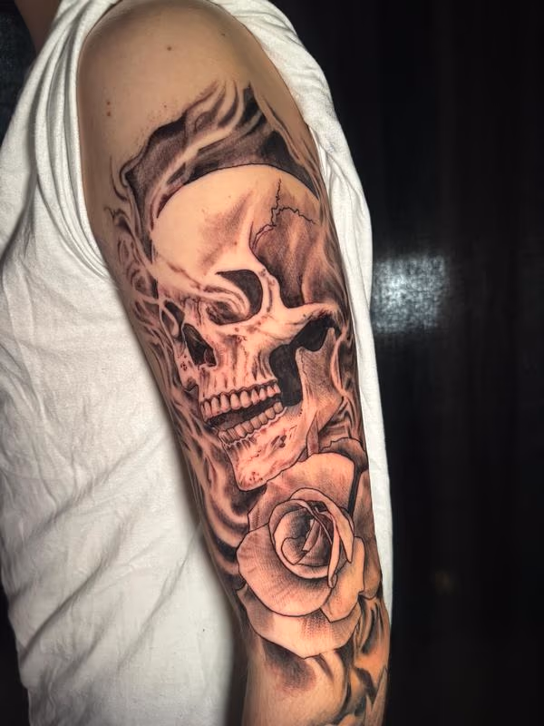 Skull and Rose Tattoo by @steviemonietattoos