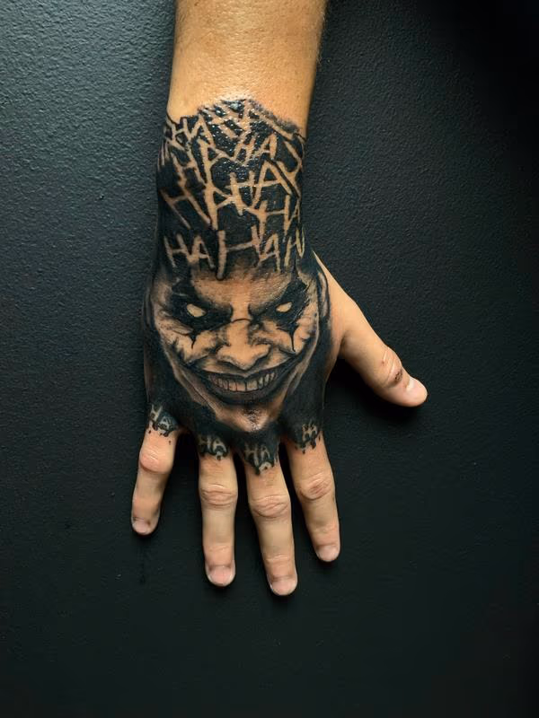 Evil Joker Hand Tattoo by @rixhierixxh