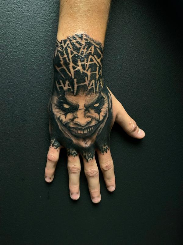 Evil Joker Hand Tattoo by @rixhierixxh