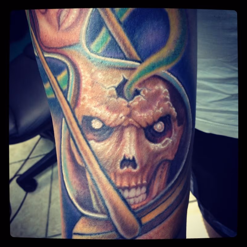 Skull in an hourglass tattoo close-up