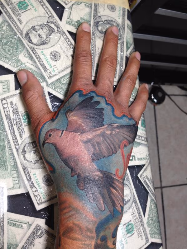 Urban Rock Realistic dove hand tattoo
